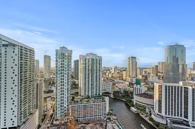 a city skyline with tall buildings and a river at Studio in Miami Brickell Business District ICON Residences in Miami