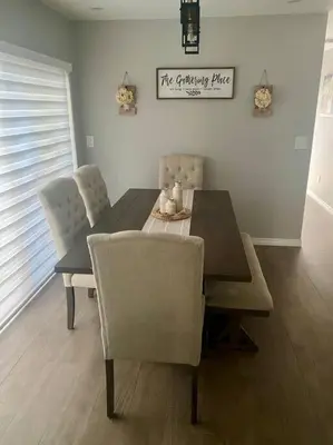 a dining room with a table and chairs and a sign at Cozy 2 Bedroom Modern Farmhouse in Miami in Tamiami