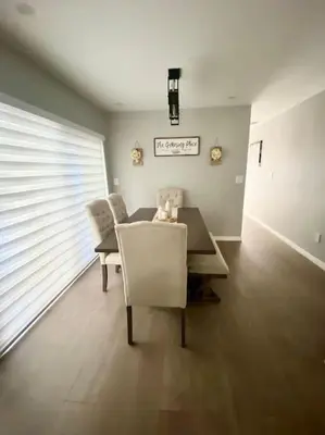 a dining room with a table and two chairs at Cozy 2 Bedroom Modern Farmhouse in Miami in Tamiami