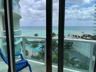 a view of the ocean from the balcony of a resort at 7th FL Ocean view spacious 1 bedroom in Hollywood