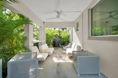 a living room with white furniture and plants at Stunning Home LifeStyle Miami in Miami
