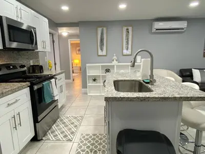 a kitchen with a sink and a counter top at Executive Luxury Suite in Fort Lauderdale