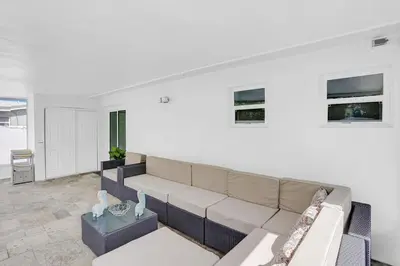 a living room with a couch and a table at Yehudas Tropical Villa with Heated Infinity Pool in Hollywood