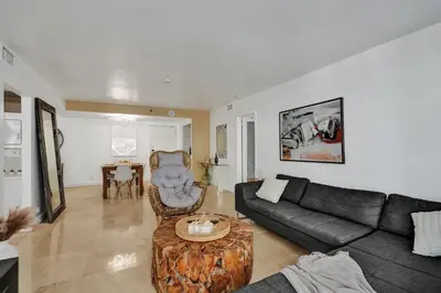 a living room with a couch and a table at Cozy Beachfront 2 BDR Miami Beach Condo 1114 in Miami Beach