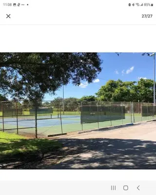 a tennis court with two tennis courts at Spacious House near Fort Lauderdale - Minutes from Beach in Plantation