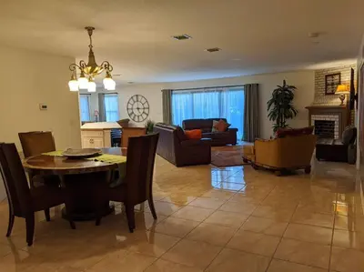 a dining room and living room with a table and chairs at Spacious House in Fort Lauderdale - Minutes from Beach in Fort Lauderdale
