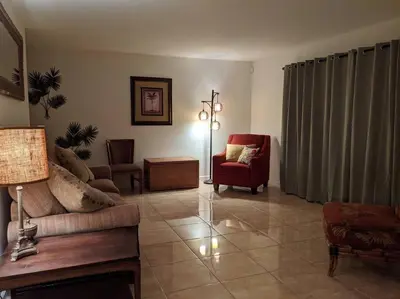 a living room with a couch and a chair at Spacious House in Fort Lauderdale - Minutes from Beach in Fort Lauderdale