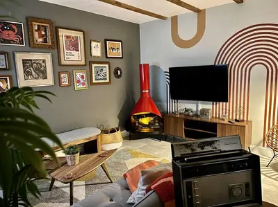 a living room with a couch and a flat screen tv at The Brickell Hideout - Charming/Cozy/Central in Miami