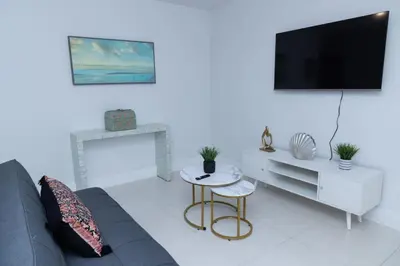 a living room with a couch and a tv at Apartments Little Habana near calle 8 in Miami