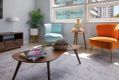 a living room with two chairs and a coffee table at 516-2Bd2Ba Midblock Apartment FREE parking in Miami