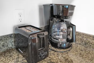 a toaster and a coffee maker on a counter at Brickell Key Gem: Stylish 1-Bed W/ Free Parking in Miami