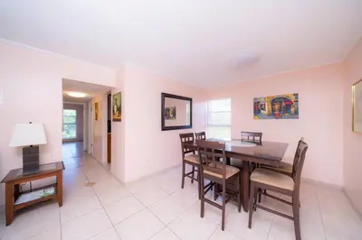 a dining room with a table and chairs at Enjoy Fully Equipped 2BR Condo Near The Beach in Sunny Isles Beach