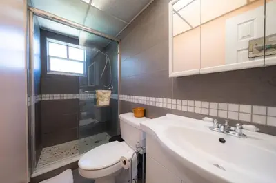 a bathroom with a toilet and a sink and a shower at Enjoy Fully Equipped 2BR Condo Near The Beach in Sunny Isles Beach