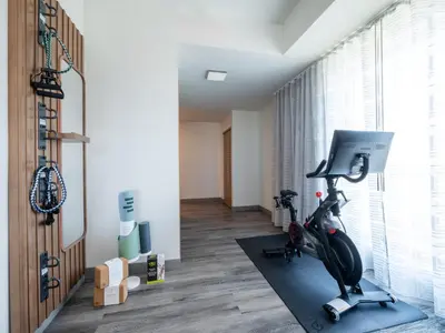 a room with a gym with a exercise bike at EVEN Hotel Miami - Doral Area by IHG in Sweetwater
