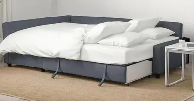 a bed with white sheets and pillows on it at Ocean Breeze Studio With Parking By The Beach in Miami Beach