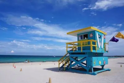 a lifeguard tower on a beach with the ocean at Ocean Breeze Studio With Parking By The Beach in Miami Beach