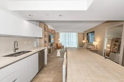 a kitchen with a long counter top in a room at 1 Hotel King Suite 1BR 1 5BA in Miami Beach
