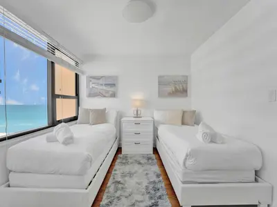a white room with two beds and a window at High floor 2BD with beach service 1608 in Miami Beach