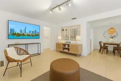 a living room with a table and chairs at Central Miami Oasis, Near Brickell, Grove & Little Havana in Miami
