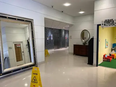 a store hallway with a mirror and a dressing room at Stunning apt! Oceanview! Parking included in Sunny Isles Beach