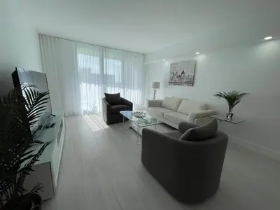 a living room with a couch and a table at Amazing Ocean View! 10 floor Parking included in Sunny Isles Beach
