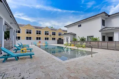 a courtyard with a swimming pool in a building at Biscayne Park Villas 15400 in Miami