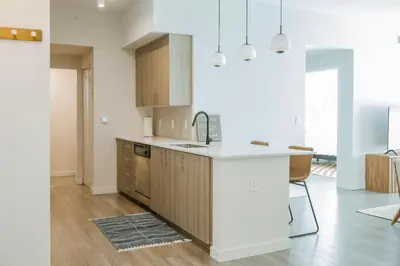 a kitchen with a sink and a counter top at 1 Mi to Hard Rock Stadium! Chic Retreat with Pool in Joe Robbie Stadium Heliport