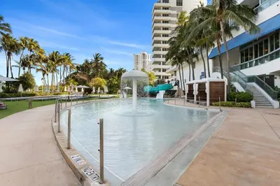 a swimming pool with a water slide in a building at FontaineBleau Resort, with Balcony 10 min from SoBe in Miami Beach