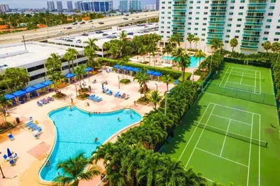 an aerial view of a resort with a tennis court at Beautiful holiday apartment in Ocean Recerve near beach in Sunny Isles Beach