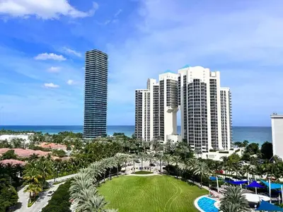 a view of a resort with tall buildings and a park at Beautiful holiday apartment in Ocean Recerve near beach in Sunny Isles Beach