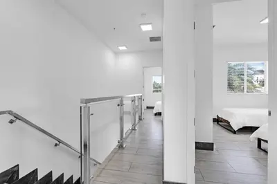 a hallway with a row of stalls in a room at Biscayne Park Villas 15450 in Miami