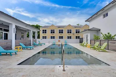 a swimming pool in front of a building at Biscayne Park Villas 15408 in Miami