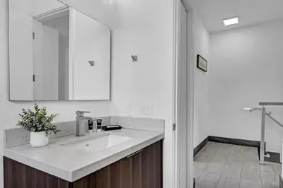 a bathroom with a sink and a mirror at Biscayne Park Villas 15408 in Miami