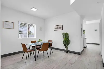 a dining room with a table and chairs at Biscayne Park Villas 15408 in Miami