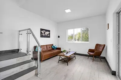 a living room with a couch and a table at Biscayne Park Villas 15440 in Miami