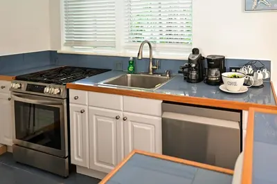 a kitchen with a sink and a stove at D' Mauchi Waterfront House in Miami