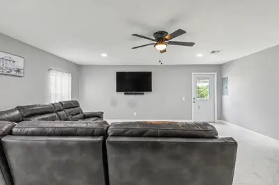 a living room with a couch and a ceiling fan at Spacious 3BR Villa in Miami with Fenced Backyard in Miami