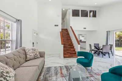 a living room with a couch and a chair at Spacious 3BR Villa in Miami with Fenced Backyard in Miami