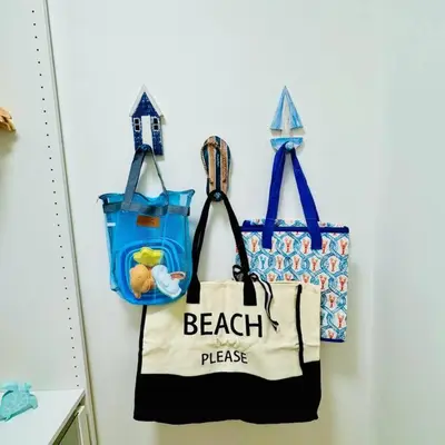 two tote bags hanging on a wall at BRAND NEW! Lovely 1 Bedroom with Pool by the Beach in Miami