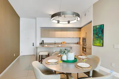 a kitchen with a table and chairs in a room at Hollywood Beachfront Apt Amazing View & Amenities in Hollywood