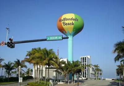 a sign for an amphibious rock sign on a street at Beachfront, Pools, Patio, King Bd Villa- Hollywood FL in Hollywood