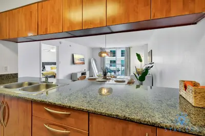 a kitchen with a sink and a counter top at Confortable Apartment with pool and gym in Miami