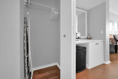 a sliding door in a kitchen with a refrigerator at Astonishing SEA VIEW Studio in Grove in Miami