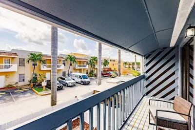 a balcony with a view of a parking lot at Miami Oasis 7 mins to Dolphin Mall MIA PS4 Games in Miami
