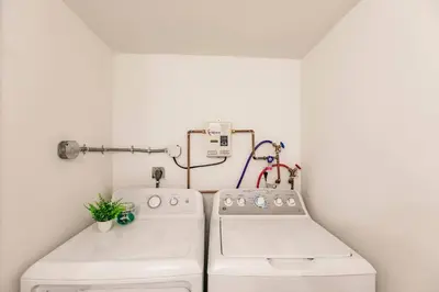a kitchen with two washing machines in a room at Miami Oasis 7 mins to Dolphin Mall MIA PS4 Games in Miami