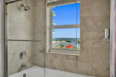 a bathroom with a shower and a window at Tropical Paradise Spacious 3 bedroom in Miami