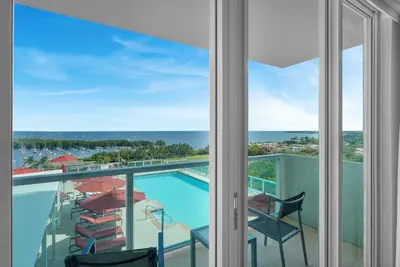 a view of the pool from the balcony of a resort at Tropical Paradise Spacious 3 bedroom in Miami