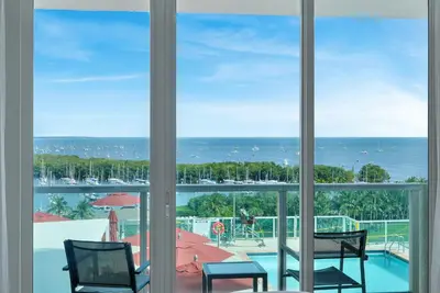 a view of the ocean from a room with windows at Tropical Paradise Spacious 3 bedroom in Miami