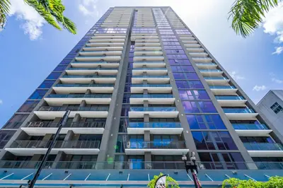 a tall building with blue sky in the background at Amazing location in the heart of Miami in Miami