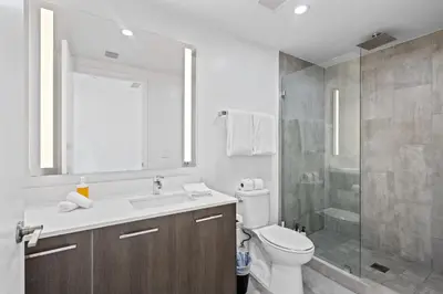 a bathroom with a toilet and a sink and a shower at Amazing location in the heart of Miami in Miami